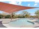 Inviting community pool with shaded seating areas and mountain views, perfect for relaxation and recreation at 9262 E Desert Park Dr, Scottsdale, AZ 85255