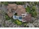 Expansive home with tile roof, pool, multiple outdoor living spaces, and lush landscaping at 9290 E Thompson Peak Pkwy # 470, Scottsdale, AZ 85255