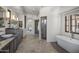 Spacious bathroom boasts double vanities, freestanding tub, and glass-enclosed shower at 9290 E Thompson Peak Pkwy # 470, Scottsdale, AZ 85255