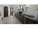 Elegant bathroom features double vanity with granite countertops, and private access to the outdoors at 9290 E Thompson Peak Pkwy # 470, Scottsdale, AZ 85255