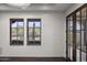 Bright, airy bedroom with hardwood floors, a view of the desert landscape, and a private balcony, creating a serene retreat at 9290 E Thompson Peak Pkwy # 470, Scottsdale, AZ 85255
