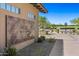 Elegant country club entrance with manicured landscaping and a view of the lush golf course at 9290 E Thompson Peak Pkwy # 470, Scottsdale, AZ 85255