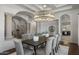 Stately dining room featuring a grand chandelier, neutral tones, and views to other living areas at 9290 E Thompson Peak Pkwy # 470, Scottsdale, AZ 85255
