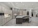 Spacious kitchen with custom cabinetry, a stone backsplash, and a large center island with seating at 9290 E Thompson Peak Pkwy # 470, Scottsdale, AZ 85255