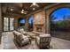 Inviting outdoor living space with stone fireplace and comfortable seating area at 9290 E Thompson Peak Pkwy # 470, Scottsdale, AZ 85255