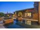 Luxurious pool area featuring a water feature and beautiful landscaping at 9290 E Thompson Peak Pkwy # 470, Scottsdale, AZ 85255