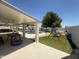 Spacious backyard featuring a pool, play area with a playset, artificial turf, and a covered patio for relaxation and entertainment at 10029 S 44Th St, Phoenix, AZ 85044