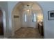 Welcoming entryway featuring a white door, neutral color scheme, tile floors, and stylish decor at 10029 S 44Th St, Phoenix, AZ 85044