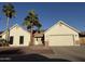 Charming single-story home with a well-manicured front yard and beautiful desert landscaping including mature palm trees at 10029 S 44Th St, Phoenix, AZ 85044