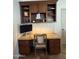 Home office area featuring a built in granite desk, wood cabinets and stylish decor at 10029 S 44Th St, Phoenix, AZ 85044