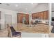 Spacious kitchen with a large island, stainless steel appliances, custom wood cabinets, and travertine floors at 10029 S 44Th St, Phoenix, AZ 85044