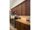 Modern kitchen featuring stainless steel oven and microwave, custom wood cabinets and granite countertops at 10029 S 44Th St, Phoenix, AZ 85044