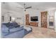 Inviting living room featuring neutral colors, travertine floors, a ceiling fan, and comfortable seating at 10029 S 44Th St, Phoenix, AZ 85044
