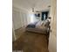 Spacious main bedroom with travertine floors, large closet, and access to the outdoors through a glass panel door at 10029 S 44Th St, Phoenix, AZ 85044