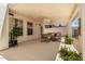 Cozy covered patio featuring comfortable seating and lush greenery, perfect for outdoor relaxation at 10029 S 44Th St, Phoenix, AZ 85044