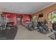 Modern gym with treadmills, elliptical machines, weights, and a TV for resident's convenience at 11640 N Tatum Blvd # 2012, Phoenix, AZ 85028