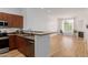 Modern kitchen with stainless steel appliances and a view into the living room at 11640 N Tatum Blvd # 2012, Phoenix, AZ 85028