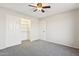 Cozy bedroom featuring carpeted floors and a closet with bifold doors, providing ample storage at 1192 E Sunset Dr, Casa Grande, AZ 85122
