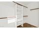 Spacious walk-in closet with multiple shelves and hanging rods for ample storage at 1192 E Sunset Dr, Casa Grande, AZ 85122