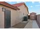 View of home exterior featuring shed, walkway, and air conditioning unit at 1192 E Sunset Dr, Casa Grande, AZ 85122