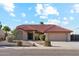 Charming single-story home featuring a well-manicured front yard and a classic red tile roof at 1192 E Sunset Dr, Casa Grande, AZ 85122