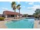 Home boasts a sparkling pool with mature landscaping and beautiful patio area at 1192 E Sunset Dr, Casa Grande, AZ 85122