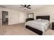 Spacious bedroom featuring a ceiling fan, neutral carpet and closet at 125 N Sunvalley Blvd # 119, Mesa, AZ 85207