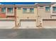 A row of townhomes featuring neutral exteriors and convenient attached garages at 125 N Sunvalley Blvd # 119, Mesa, AZ 85207