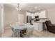 Cozy kitchen and dining space featuring white cabinets and stainless steel appliances at 125 N Sunvalley Blvd # 119, Mesa, AZ 85207