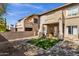 Private backyard area with artificial turf, gravel landscaping, and a covered patio at 12852 N Mountainside Dr # 2, Fountain Hills, AZ 85268