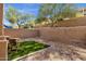 Backyard featuring a small turfed area and desert landscaping at 12852 N Mountainside Dr # 2, Fountain Hills, AZ 85268