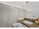 Bright bathroom featuring a granite vanity, toilet, shower, and sleek finishes for a modern feel at 12852 N Mountainside Dr # 2, Fountain Hills, AZ 85268
