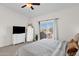 Bright bedroom with neutral paint, minimalist furniture, and sliding glass door to balcony at 12852 N Mountainside Dr # 2, Fountain Hills, AZ 85268