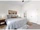 Spacious bedroom with a large bed, tasteful decor, and an ensuite bathroom nearby at 12852 N Mountainside Dr # 2, Fountain Hills, AZ 85268