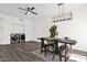 Open dining area featuring a modern light fixture, table with seating, and laundry area at 12852 N Mountainside Dr # 2, Fountain Hills, AZ 85268