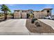 Beautiful exterior view of a modern home with private garages and desert landscaping at 12852 N Mountainside Dr # 2, Fountain Hills, AZ 85268