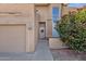 Charming home exterior featuring a front door with decorative wreath and low-maintenance landscaping at 12852 N Mountainside Dr # 2, Fountain Hills, AZ 85268