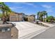 Contemporary home showcasing a spacious driveway, lush palm trees and multiple garages at 12852 N Mountainside Dr # 2, Fountain Hills, AZ 85268