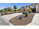 Well-maintained home exterior with an expansive driveway, desert landscaping and multiple garages at 12852 N Mountainside Dr # 2, Fountain Hills, AZ 85268