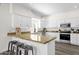 Kitchen with white cabinets, a breakfast bar, and stainless steel appliances at 12852 N Mountainside Dr # 2, Fountain Hills, AZ 85268