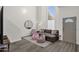 Bright living room with high ceilings, wood floors, neutral-toned furniture and modern accents at 12852 N Mountainside Dr # 2, Fountain Hills, AZ 85268