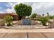 Entrance to The Springs Swim and Racquet Club with lush landscaping and inviting signage at 1379 E Butler Cir, Chandler, AZ 85225