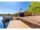 This photo features a private dock with a boat, perfect for enjoying waterfront living with lovely backyard and homes at 1379 E Butler Cir, Chandler, AZ 85225
