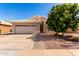Charming single-story home with a well-maintained front yard and an attached two-car garage, offering curb appeal at 1379 E Butler Cir, Chandler, AZ 85225