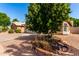 Charming single-story home featuring a well-manicured yard and mature trees for added curb appeal at 1379 E Butler Cir, Chandler, AZ 85225