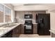 Well lit kitchen features stone countertops, stainless steel appliances, and tile backsplash at 1379 E Butler Cir, Chandler, AZ 85225