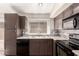 This contemporary kitchen features granite countertops, stainless steel appliances, and designer backsplash at 1379 E Butler Cir, Chandler, AZ 85225