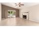 Bright living room with fireplace and sliding glass door leading to the backyard at 1379 E Butler Cir, Chandler, AZ 85225