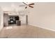 Living room and kitchen with hard flooring, ceiling fan, and natural light at 1379 E Butler Cir, Chandler, AZ 85225