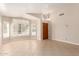 Open living room with shuttered windows and a front door at 1379 E Butler Cir, Chandler, AZ 85225